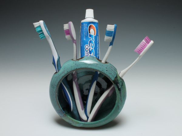 With toothbrushes