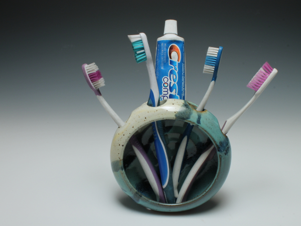 Toothbrush Holder with toothbrushes and toothpaste