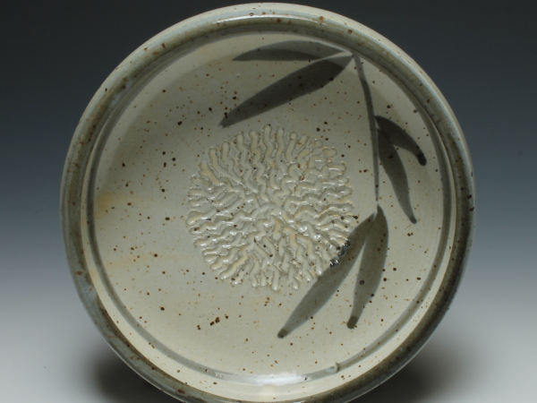 Dipping dish with garlic grater top view shown in Leaf