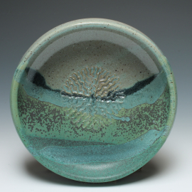 Dipping dish with garlic grater top view shown in Ocean